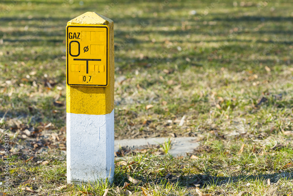 Yellow bars indicative of natural gas with a sign. Yellow bars indicative of natural gas with a sign.