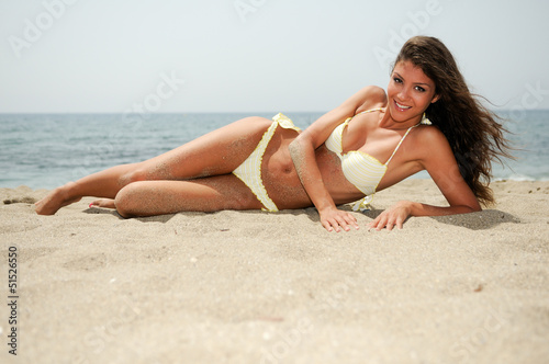 Woman with beautiful body on a tropical beach