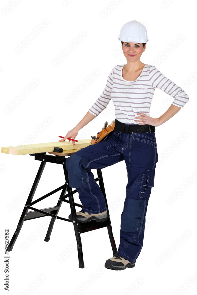 female carpenter and workbench isolated on white female carpenter and workbench isolated on white
