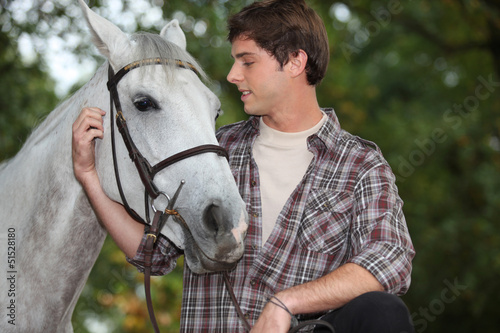 Man looking after horse