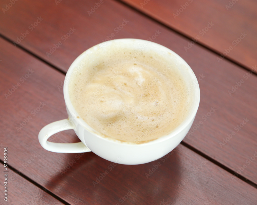 Cup of cappuccino on table Cup of cappuccino on table