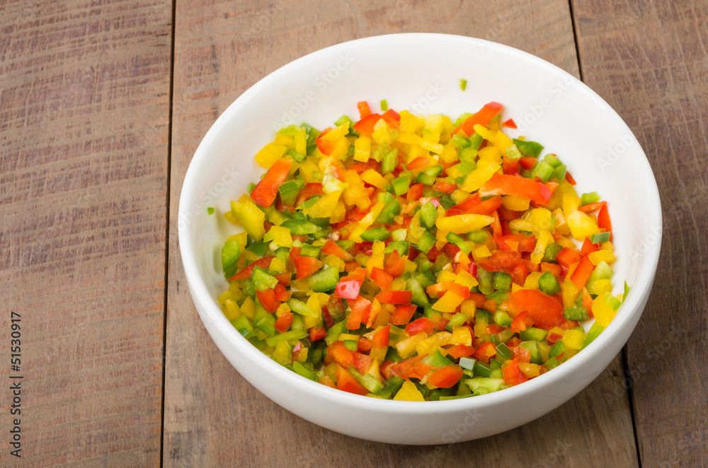 Bowl of freshly diced red yellow peppers Bowl of freshly diced red yellow peppers