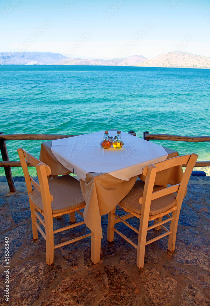 greek outdoor restaurant with Mediterranean sea view(Crete, Gree