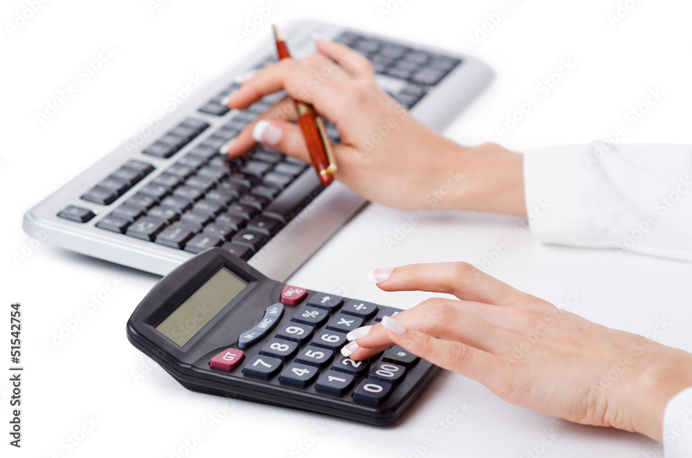 Hands working on the calculator Hands working on the calculator