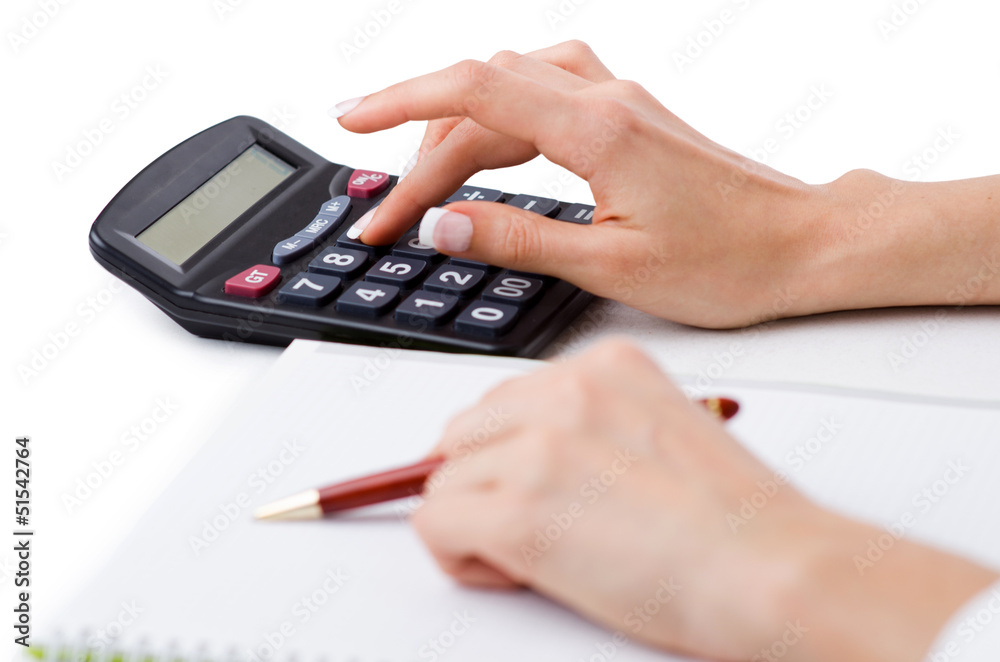 Hands working on the calculator Hands working on the calculator