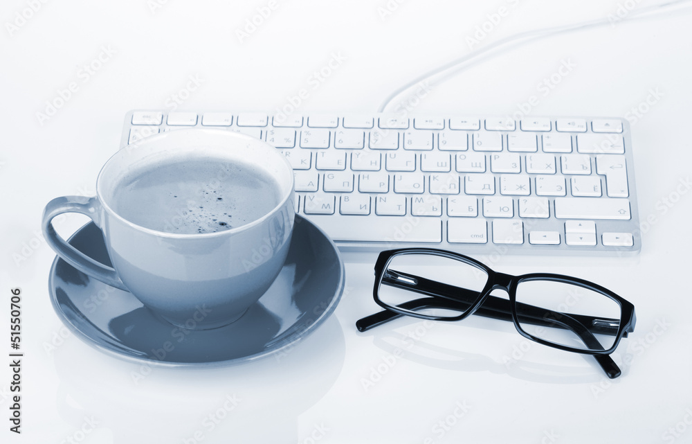 Coffee cup, glasses and computer keyboard Coffee cup, glasses and computer keyboard