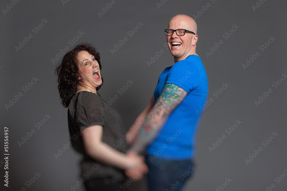 Obraz premium Happy young couple in love together. Studio shot.