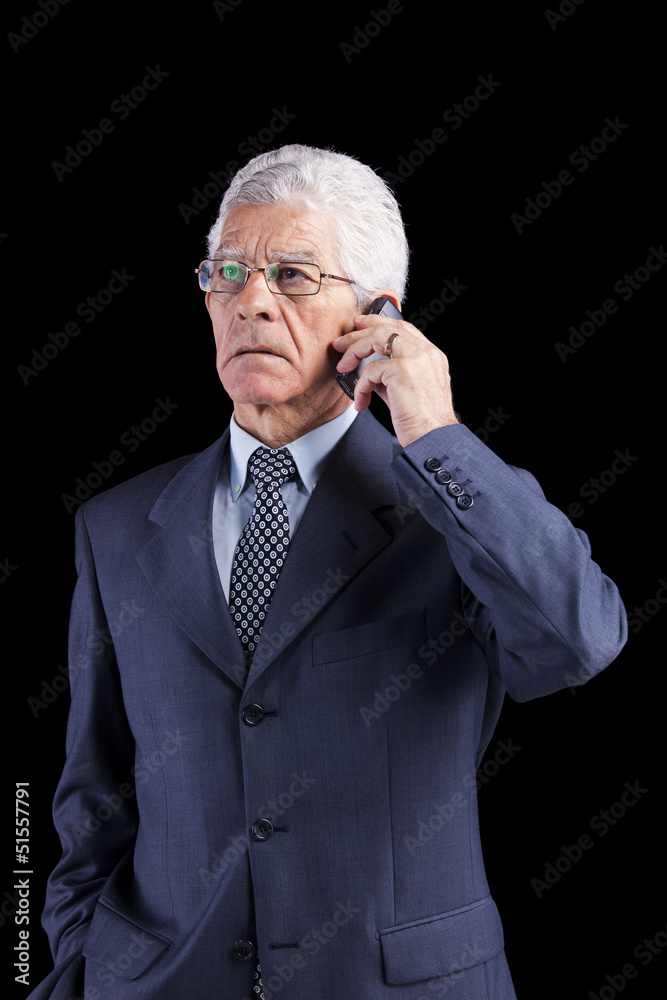 Senior Businessman talking at the cellphone Senior Businessman talking at the cellphone