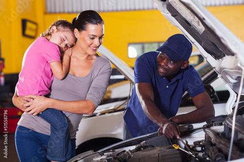 young mother taking her car for repair