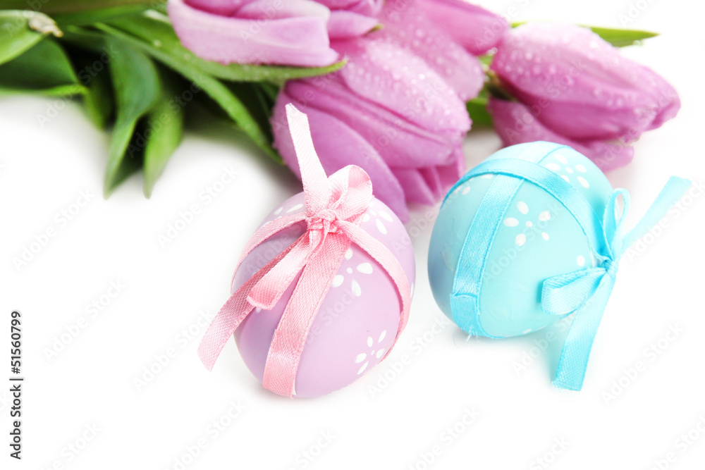 Bright easter eggs and tulips, isolated on white Bright easter eggs and tulips, isolated on white