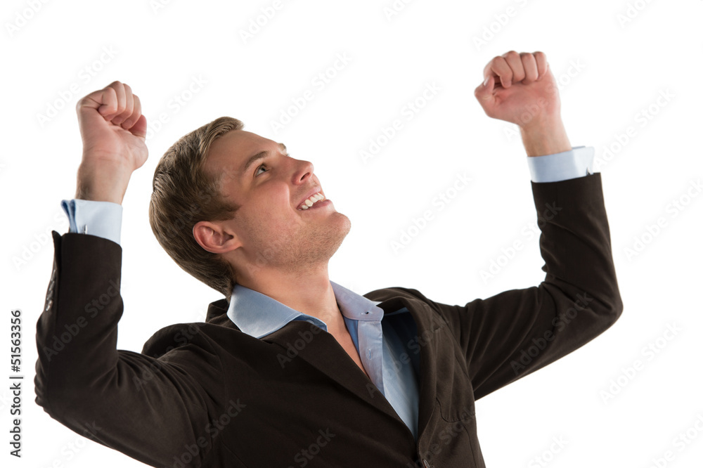 An excited young executive celebrating the success of his busine An excited young executive celebrating the success of his busine
