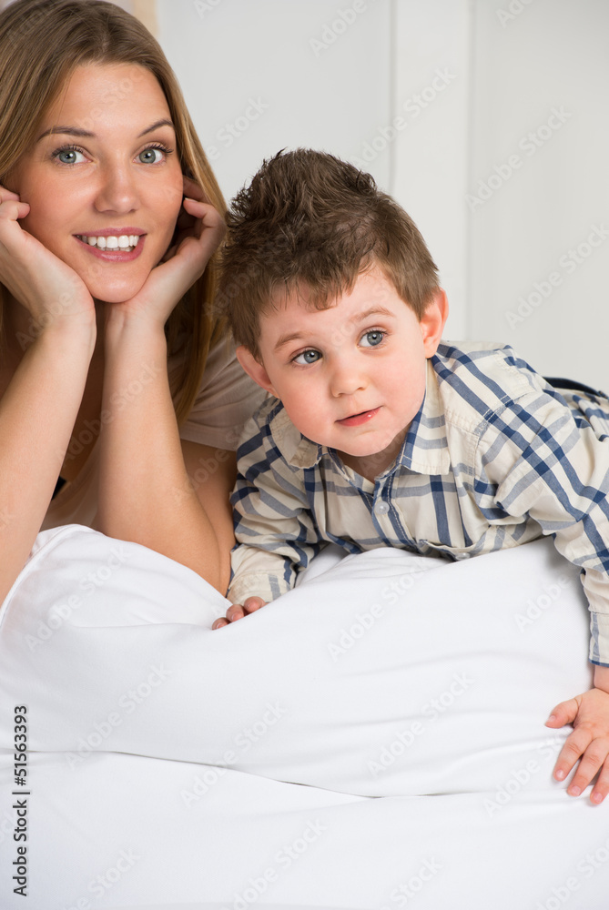 Happy young mother and her cute son playing at home Happy young mother and her cute son playing at home