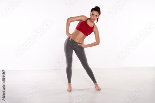 Sporty woman doing stretching exercises