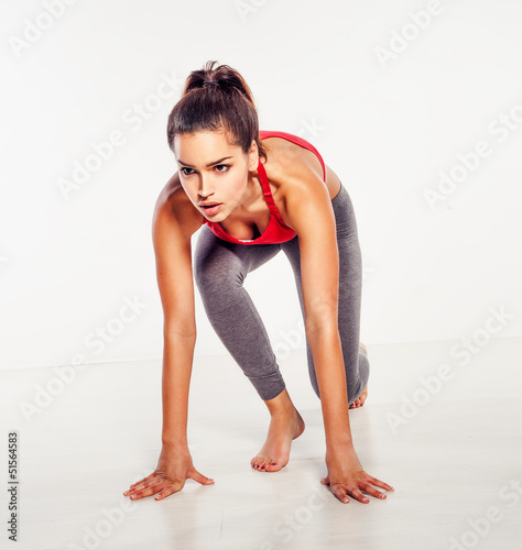 Athletic woman in starter position