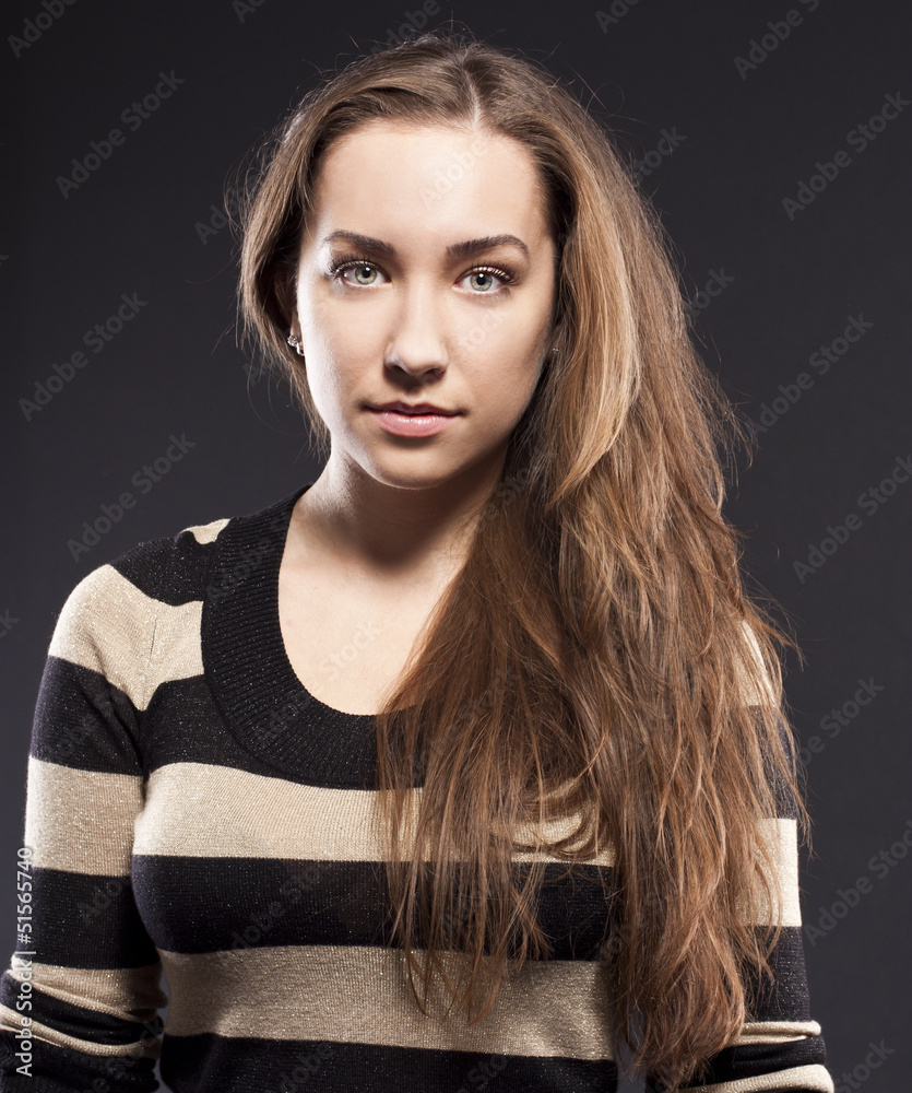 studio portrait of excited woman. long hair, brunette studio portrait of excited woman. long hair, brunette