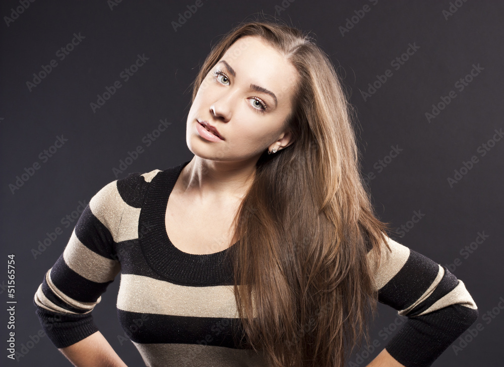Fototapeta premium positive female. dark studio background