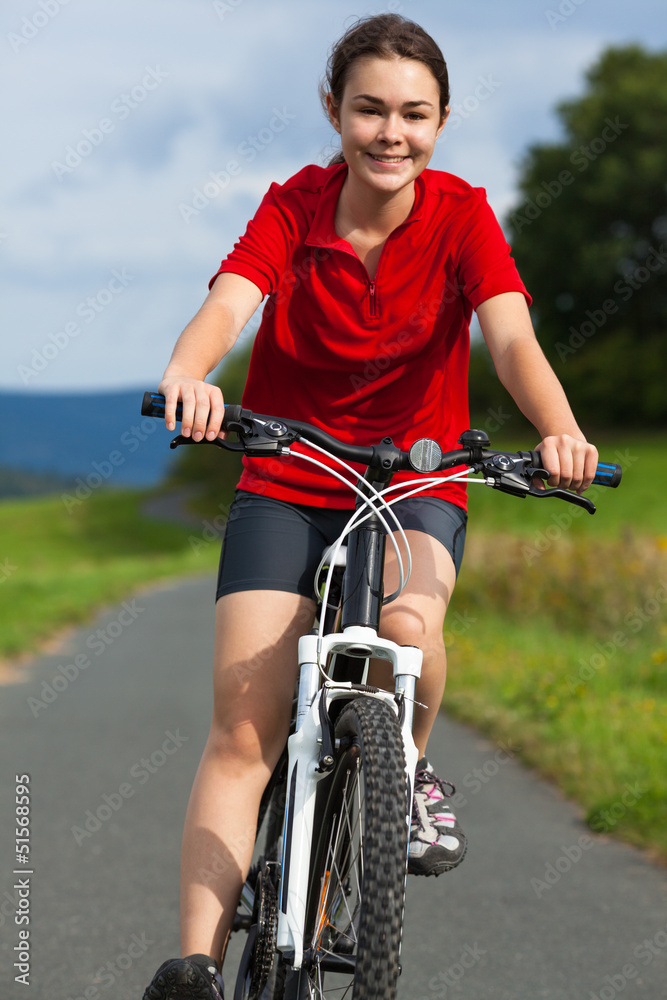 Naklejka premium Healthy lifestyle - girl biking