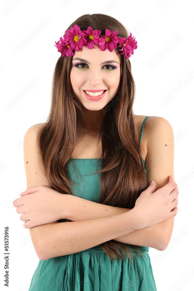 Young beautiful girl in green dress with bright wreath