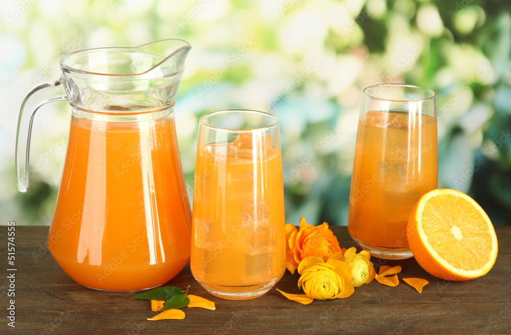 Glasses and pitcher of orange juice Glasses and pitcher of orange juice