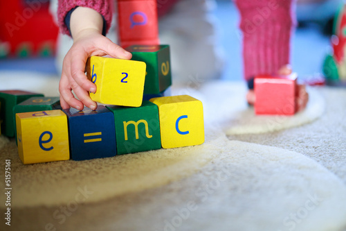 Little hands playing with building blocks
