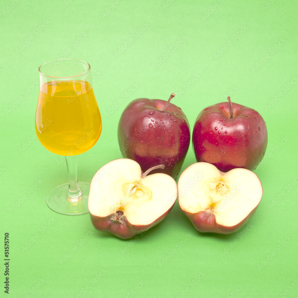 red apple close-up isolated on green background red apple close-up isolated on green background
