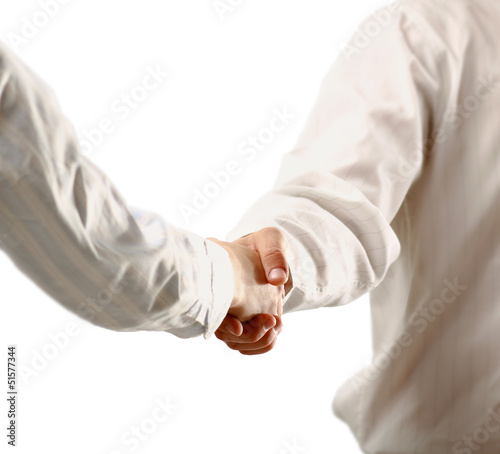 Closeup of a business handshake, isolated on white