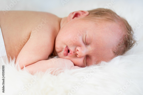newborn baby boy sleeping o...