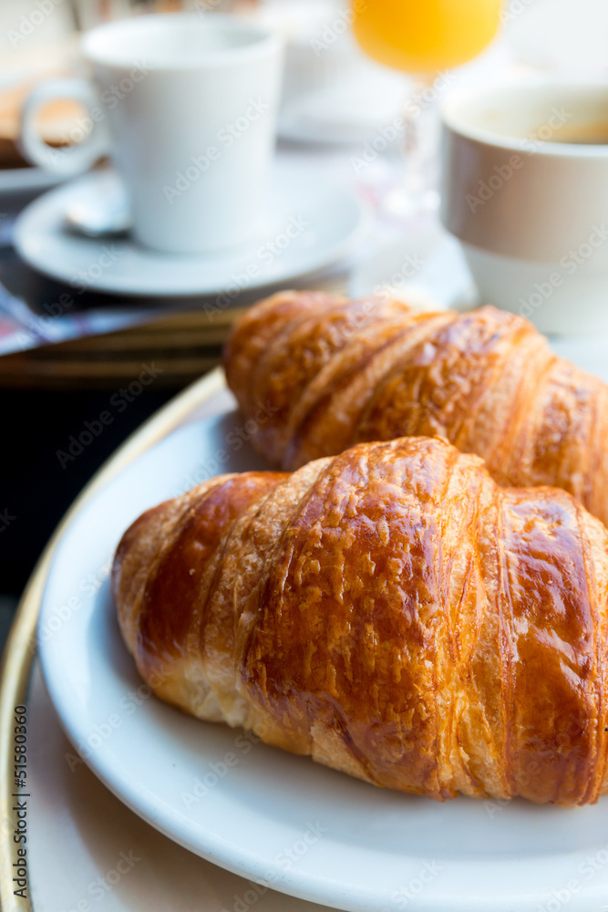 Breakfast with coffee and croissants