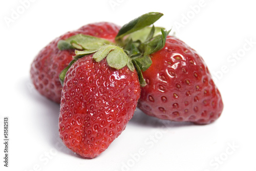 Three strawberries isolated on white