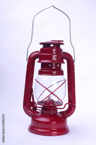 Red paraffin lamp on a white background photo