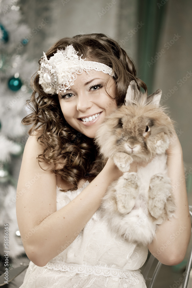 Fashion woman in luxury interior with bunny Fashion woman in luxury interior with bunny