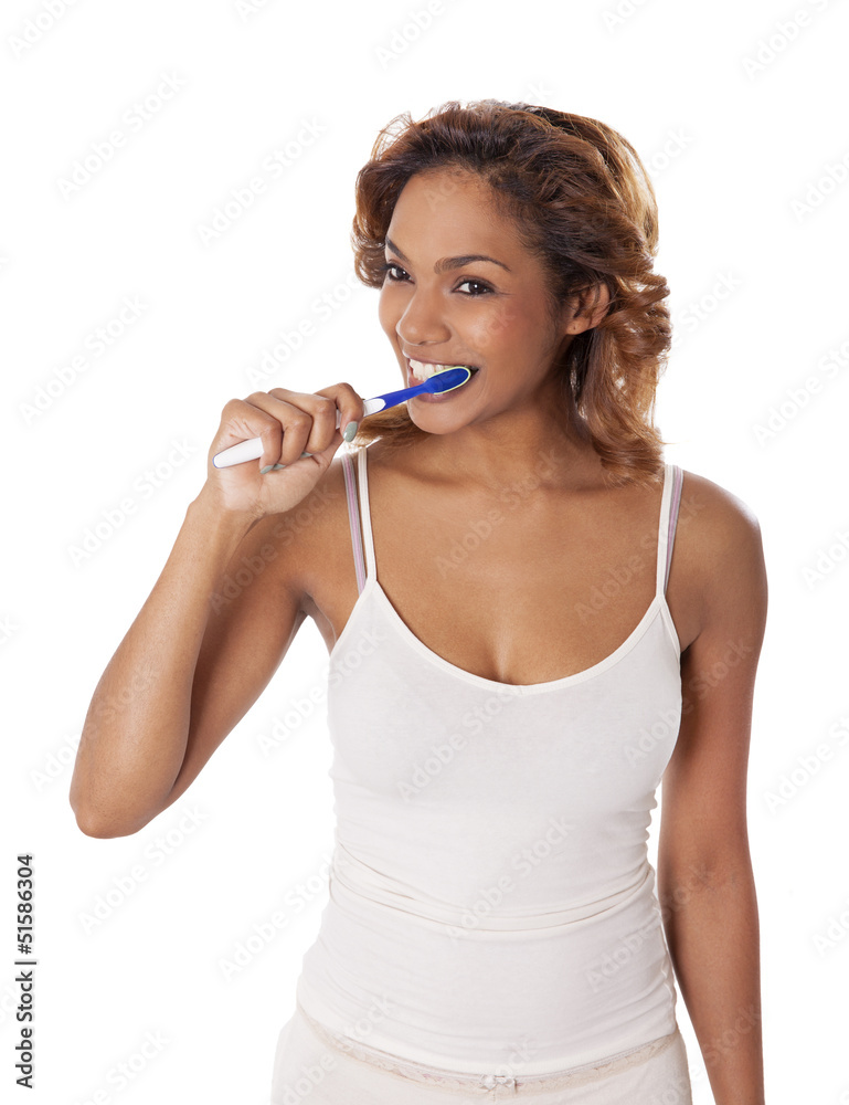 Beautiful young woman brushing her teeth. Beautiful young woman brushing her teeth.