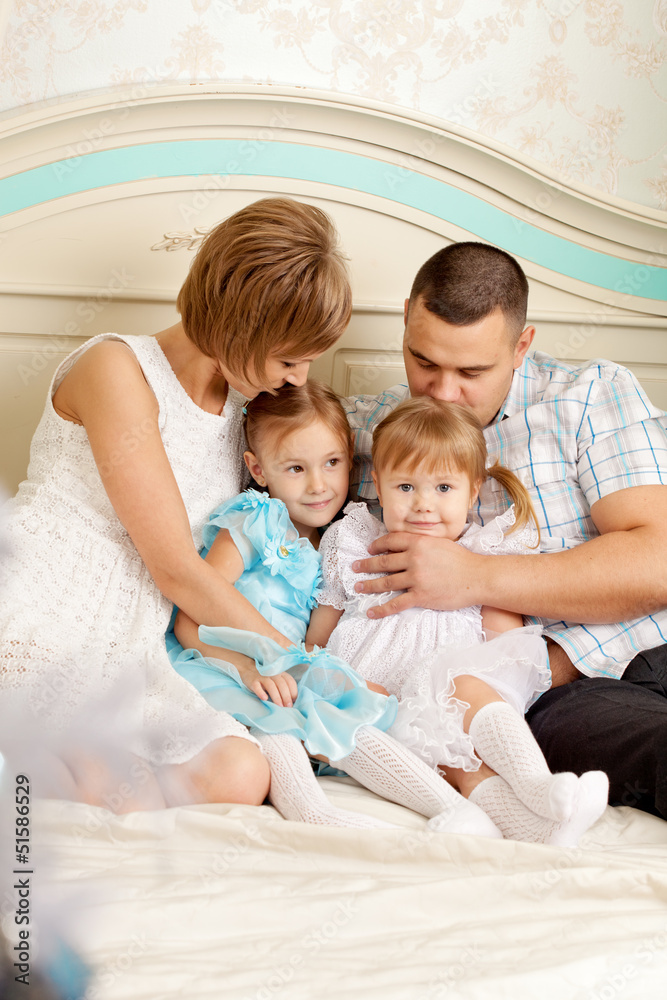 Happy family smiling at home Happy family smiling at home