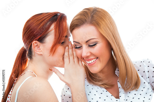 Принти на полотні Two happy young girl friends talking or whispering