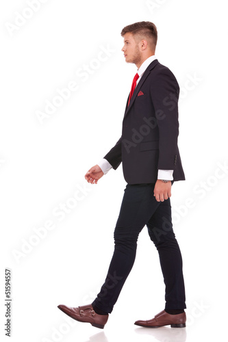 Canvas Print business man walks sideway