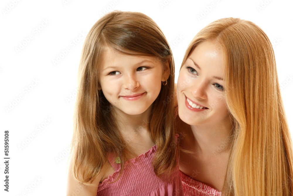 portrait of two sisters happy smiling (child and teen) looking t portrait of two sisters happy smiling (child and teen) looking t