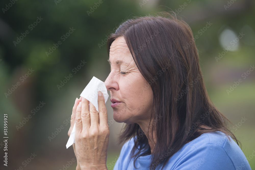 Wall Mural Woman suffering flu or hayfever outdoor