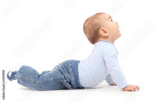 Funny toddler boy playing on a white background.