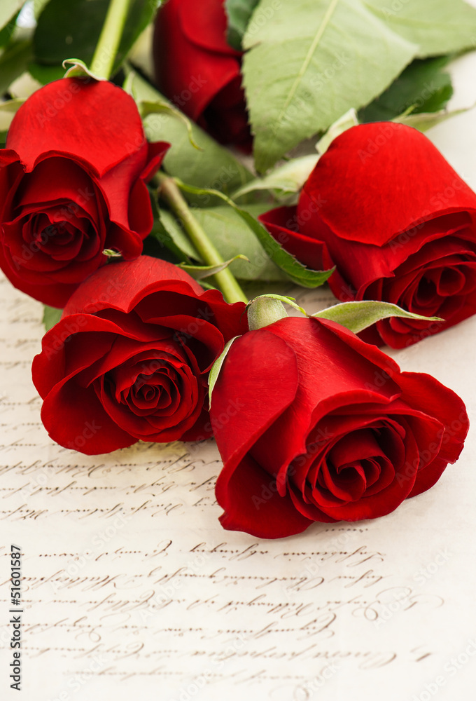 red rose flowers and old love letters red rose flowers and old love letters