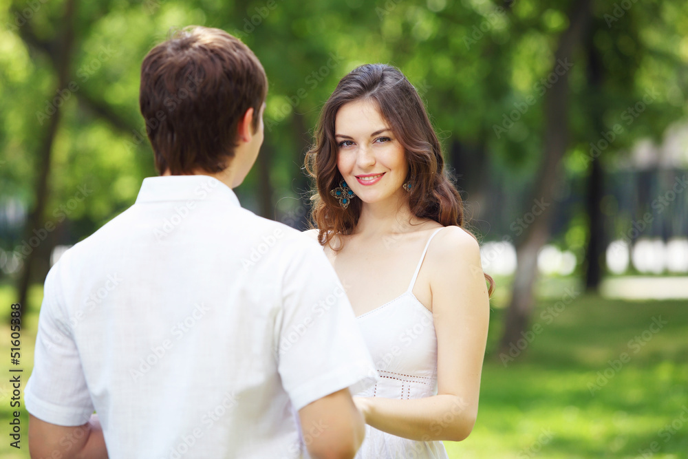 Young love Couple smiling under blue sky Young love Couple smiling under blue sky