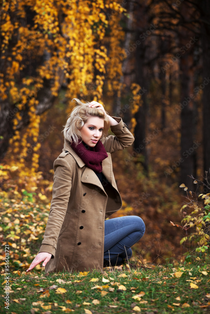 Young blond woman in autumn forest Young blond woman in autumn forest
