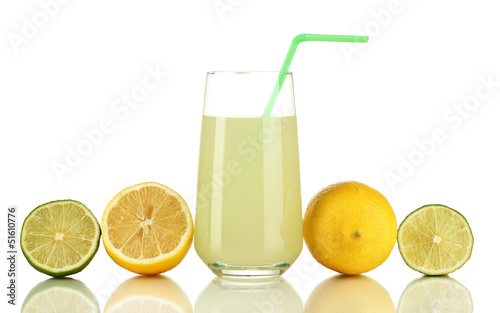 Delicious lemon juice in glass and limes and lemons next to it