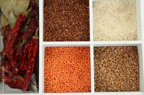 Assortment of cereals in white wooden box close up