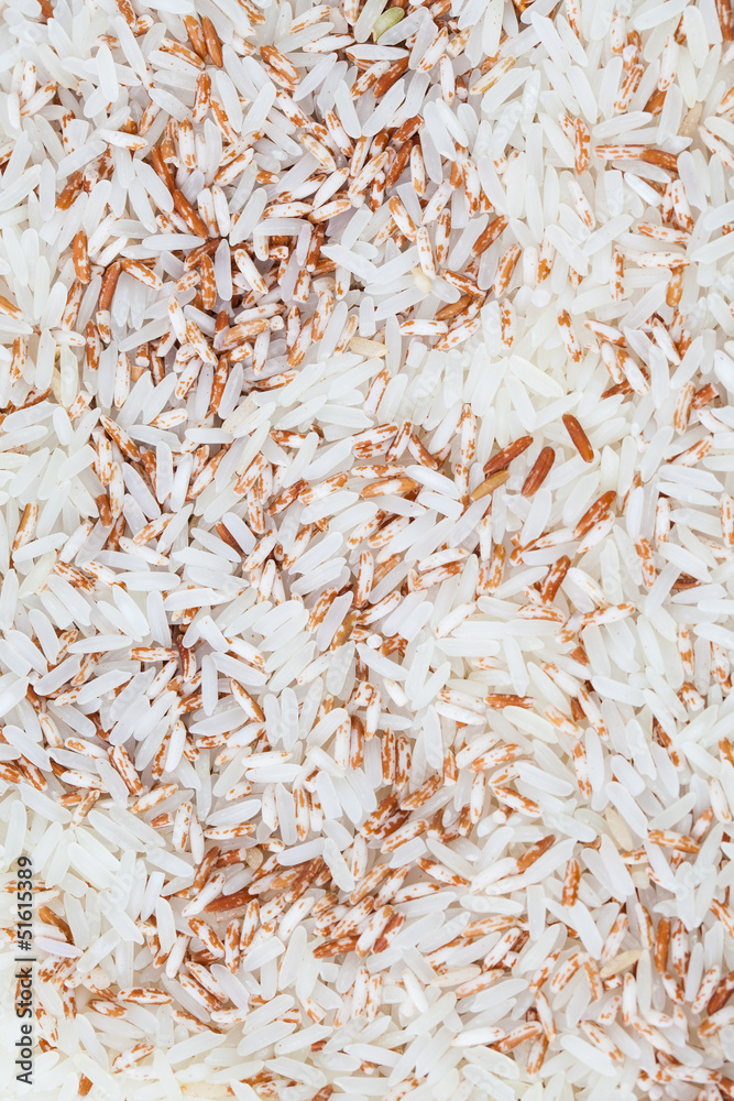 Fototapeta premium Brown Rice uncooked raw cereals, macro closeup
