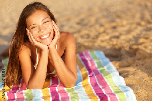 Beautiful woman sunbathing on the beach