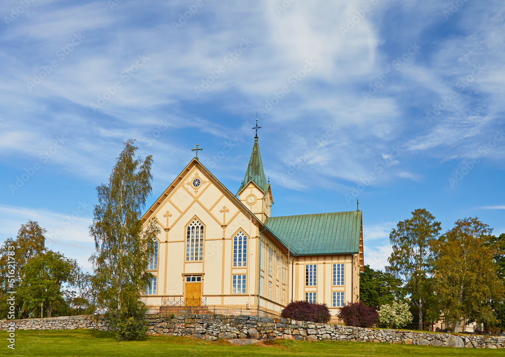 The Finnish wooden  rural Catholic church in the sunny summer da