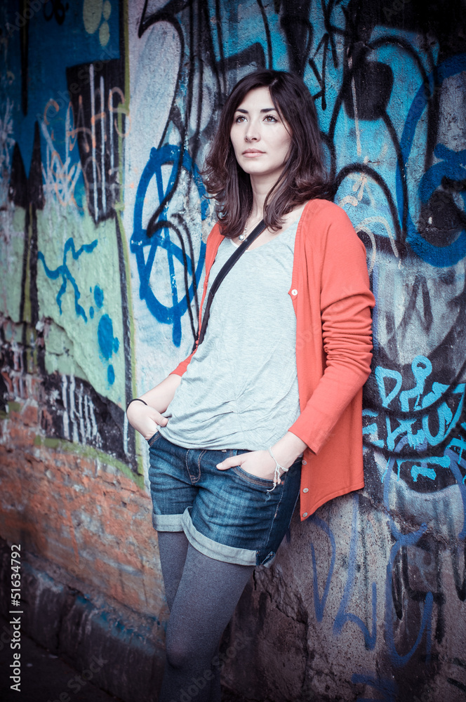 Naklejka premium Beautiful stylish woman listening to music