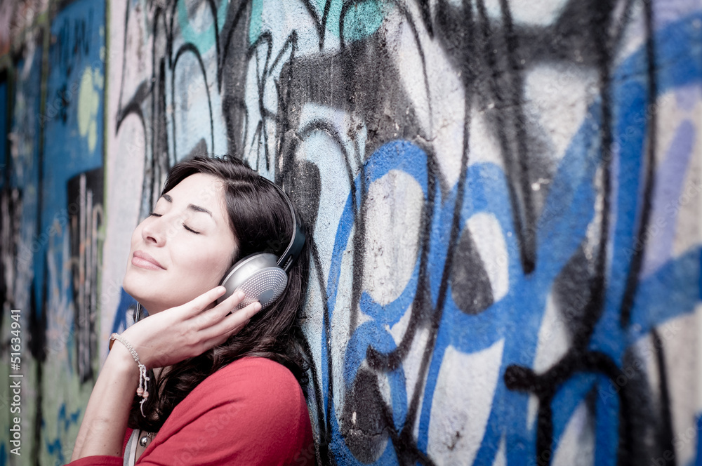 Beautiful stylish woman listening to music