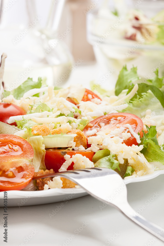 Close-up of salad. Lettuce, tomato, cucumber. Selective focus Close-up of salad. Lettuce, tomato, cucumber. Selective focus