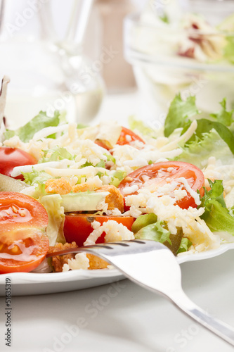 Close-up of salad. Lettuce, tomato, cucumber. Selective focus